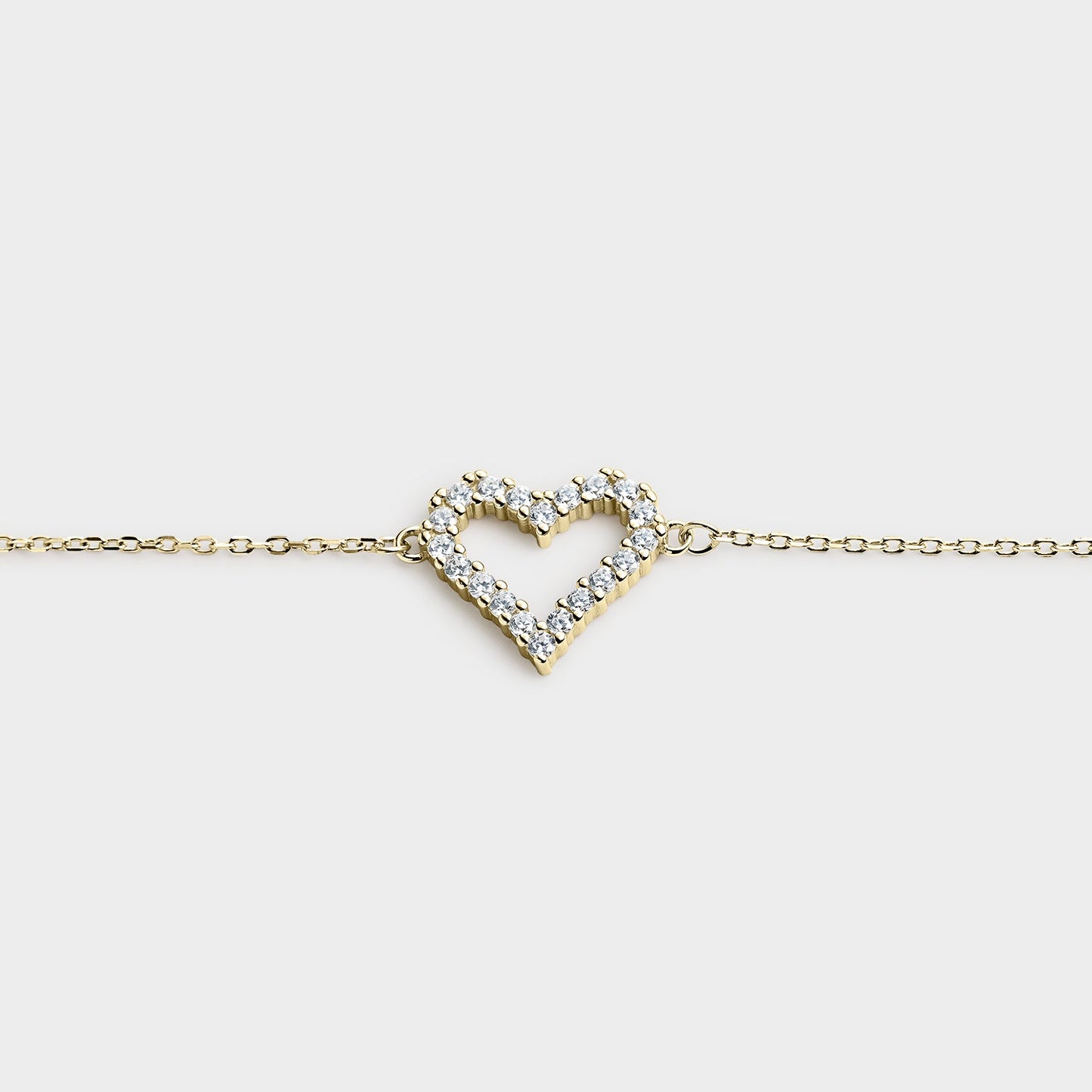 PULSERA CORAZÓN CENTRAL EN PLATA BAÑADA EN ORO