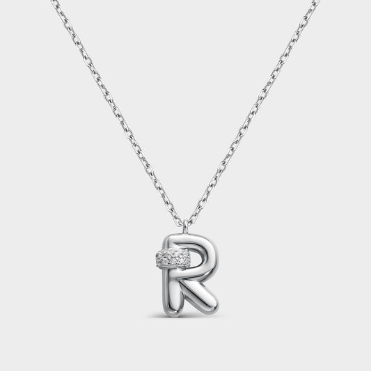 Collar con inicial "R" con volumen, plata y linea de circonitas