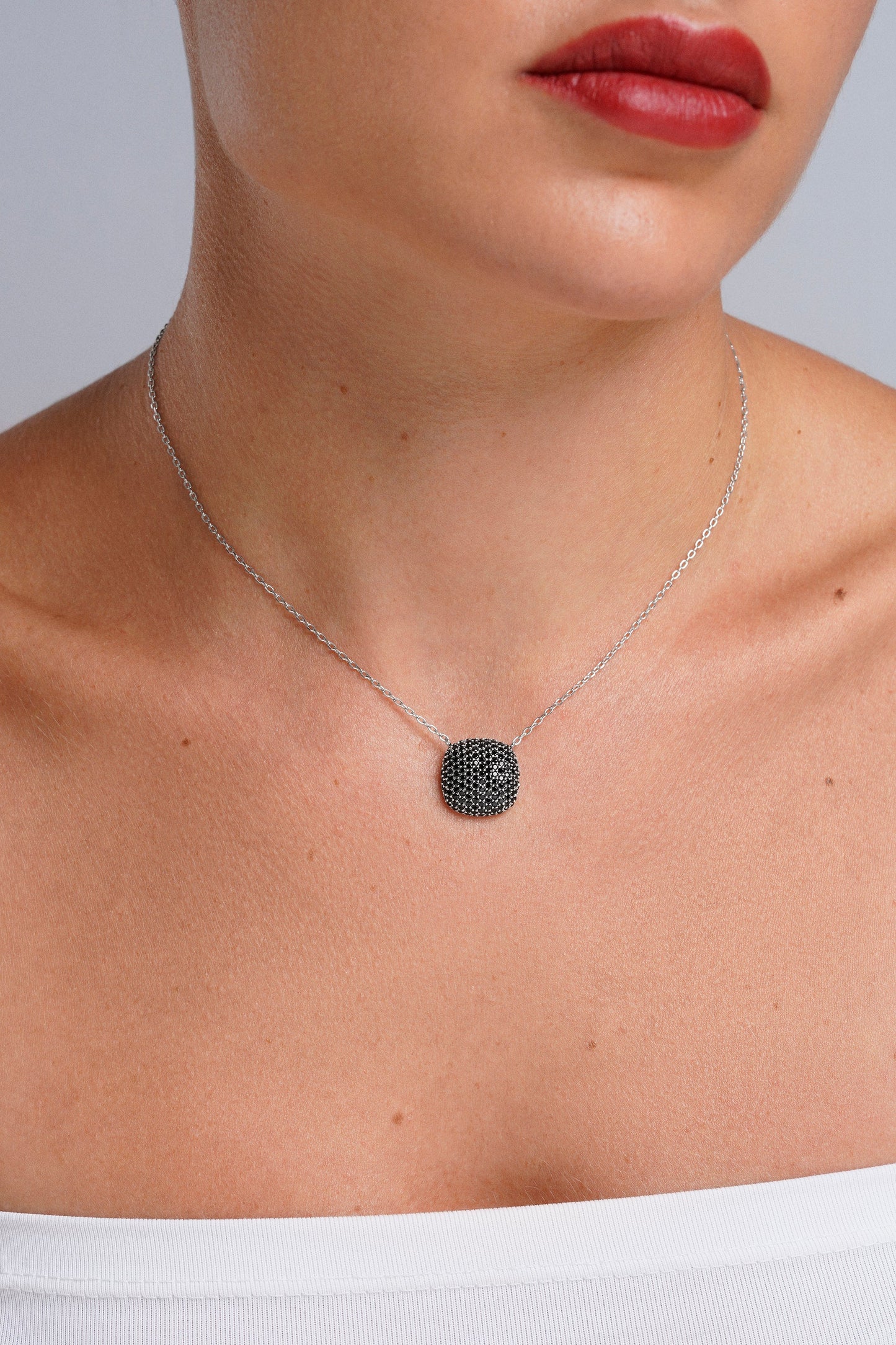 Collar cushion pavé negro